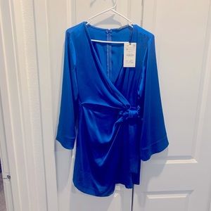 Satin blue Zara dress, never worn. Has a nice crossover flattering shape